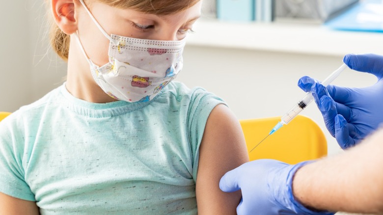 girl getting vaccine