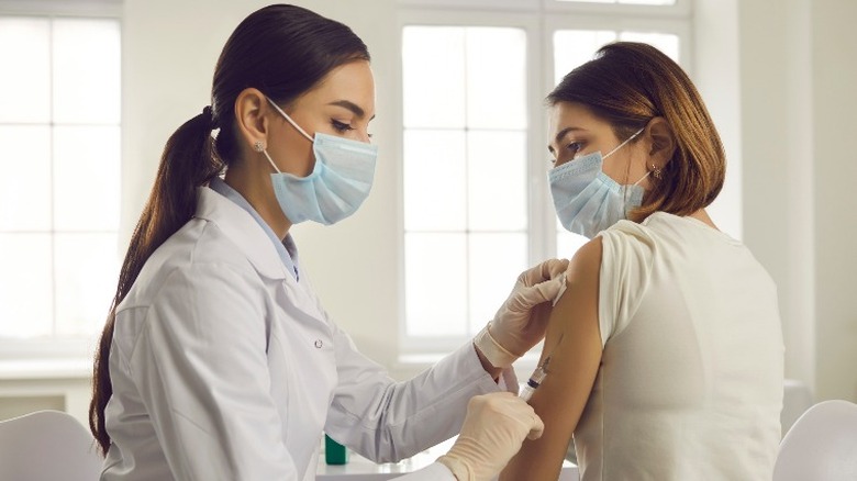doctor gives vaccine