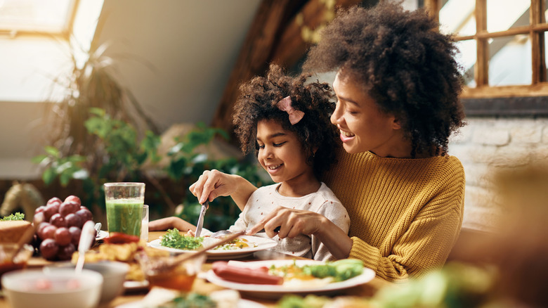 Woman and child eating food