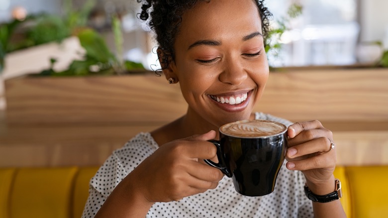 woman drinking coffee