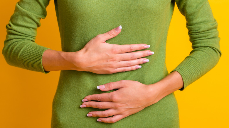 woman experiencing stomach pain