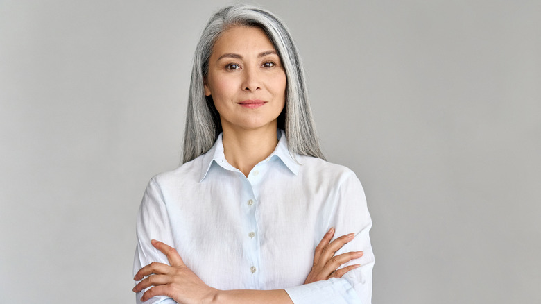 Older woman with arms folded