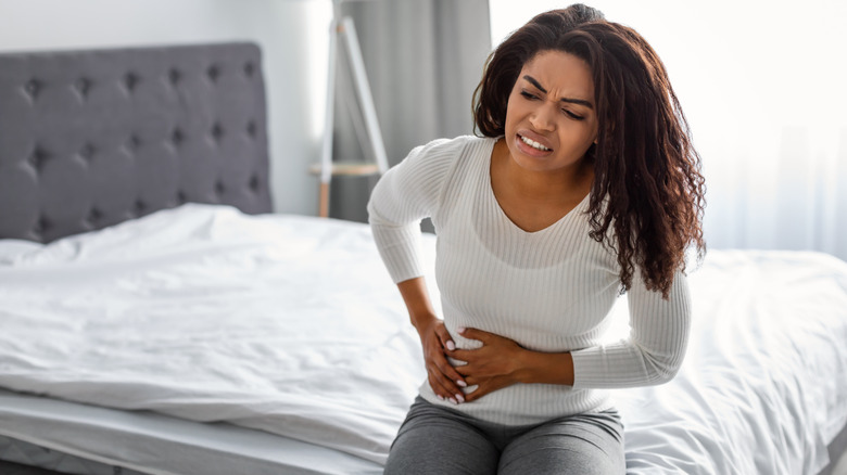 Woman holding bladder