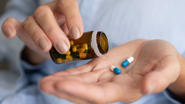Older person taking medicine