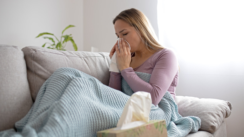 Woman feeling sick because of COVID-19