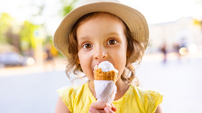 child eating an ice cream cone