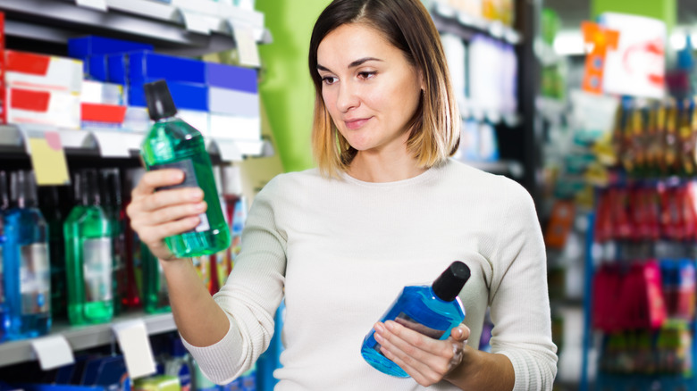 Woman purchasing mouthwash