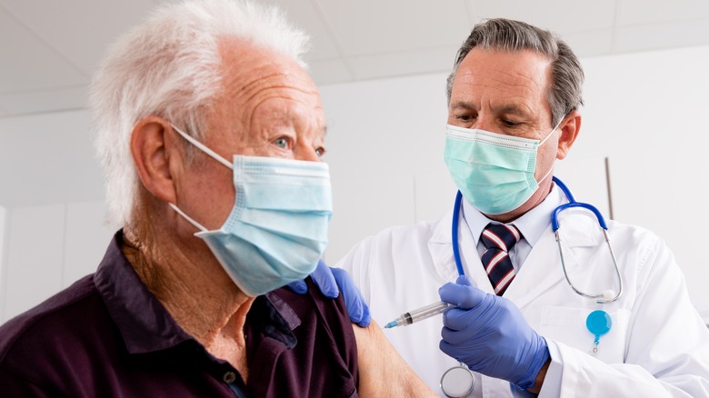 Older man receiving vaccine