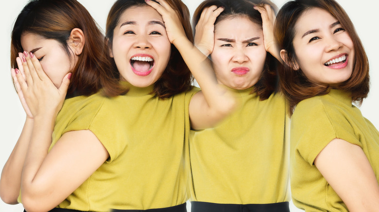 four young women making faces
