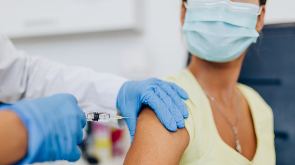 A person receiving the COVID-19 Vaccine 