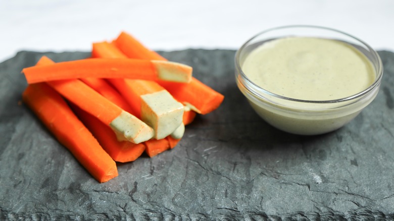 Carrot sticks and vegan ranch dressing