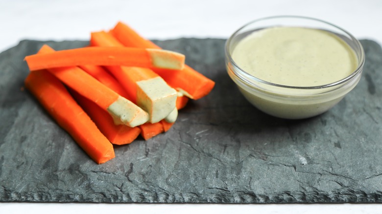 Vegan ranch dressing and carrot sticks