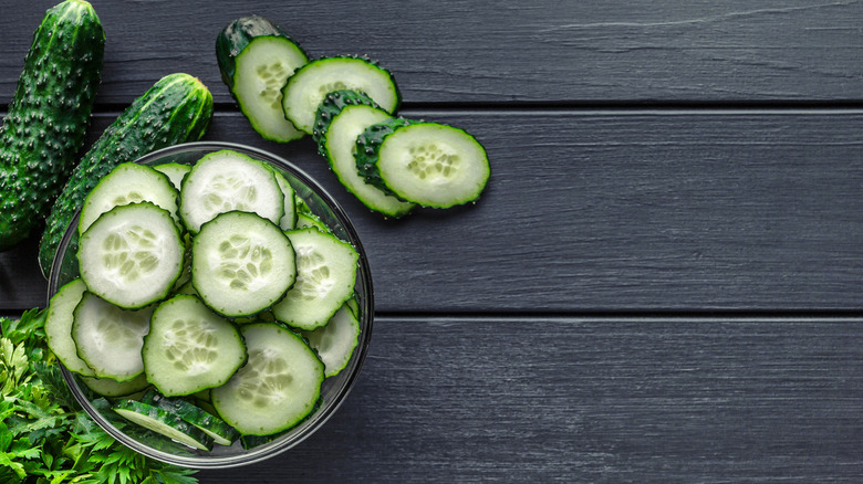 Sliced zucchini on a black table