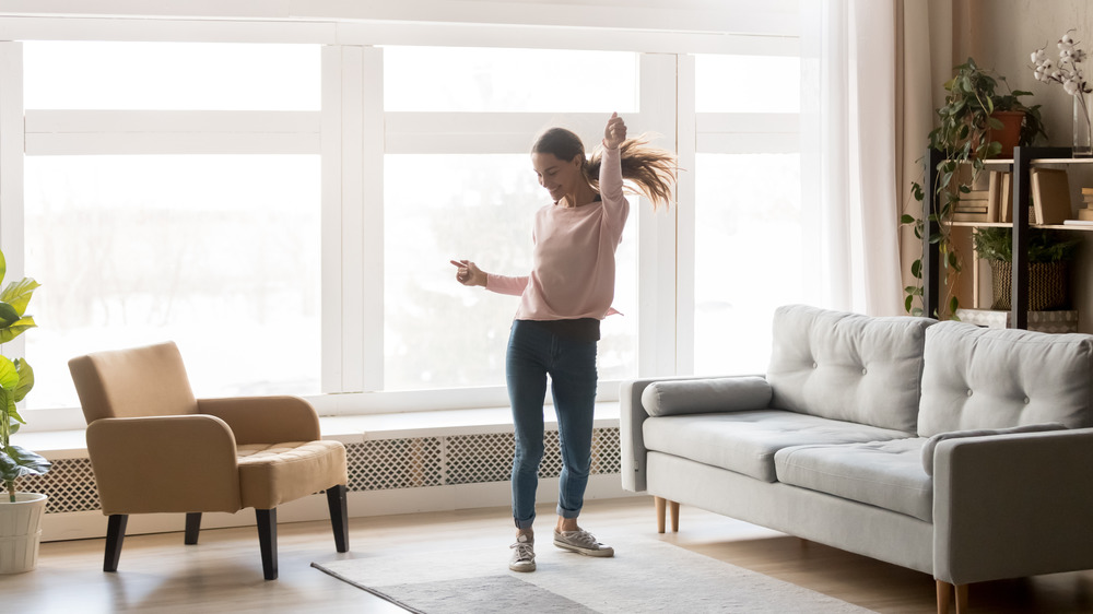 Woman dancing and smiling