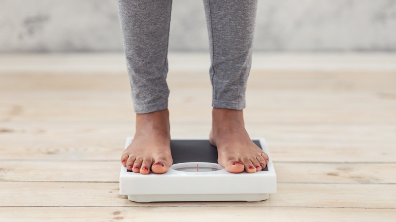 feet stepping on scale