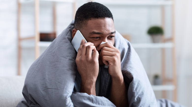 Man wrapped in blanket