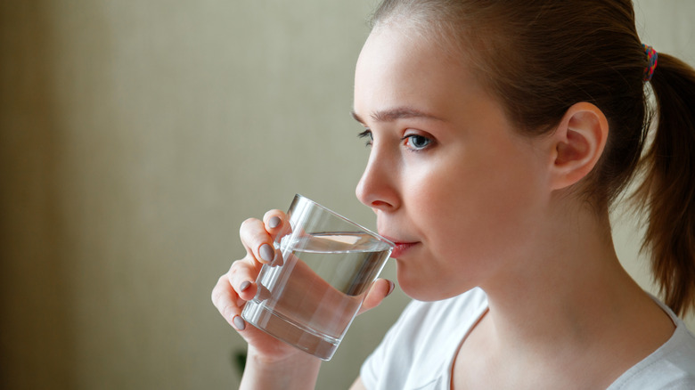 young girl drinking water