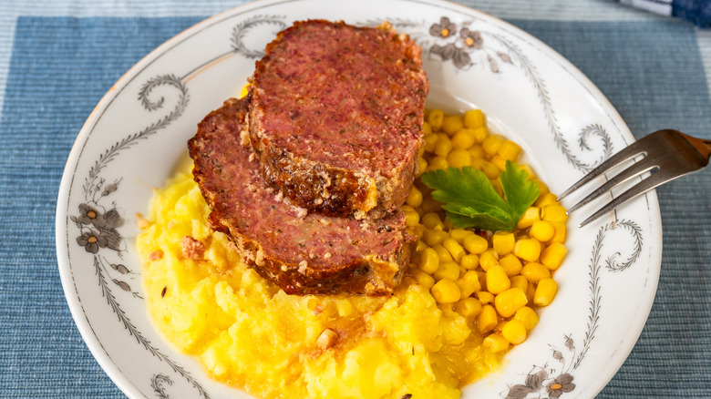 Meatloaf on mashed potatoes and corn