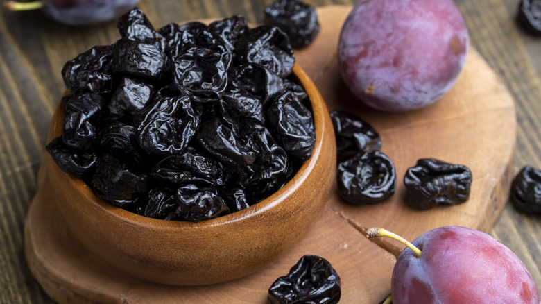 prunes in a wooden bowl