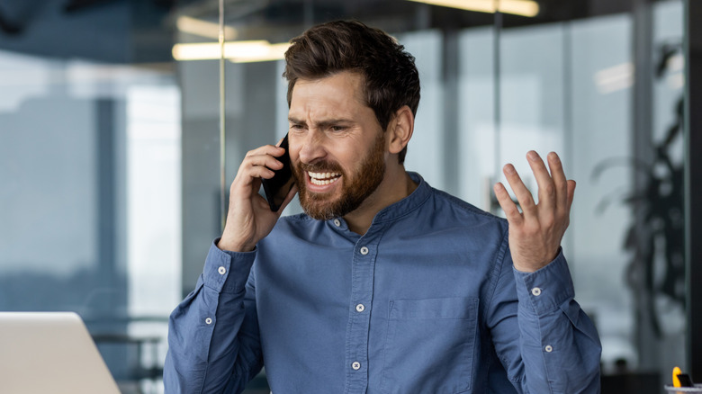 angry man on telephone