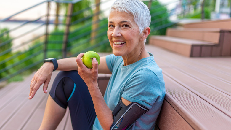 Woman eating apple