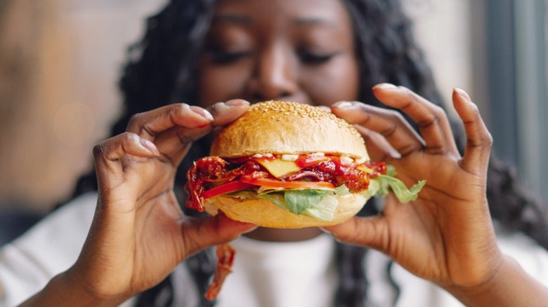 woman eating burger