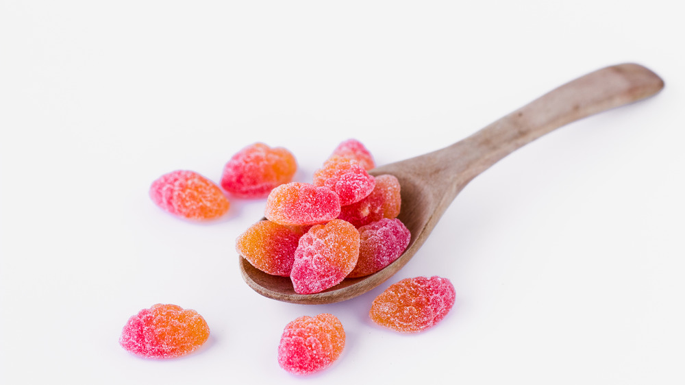 sugar coated gummies on a spoon