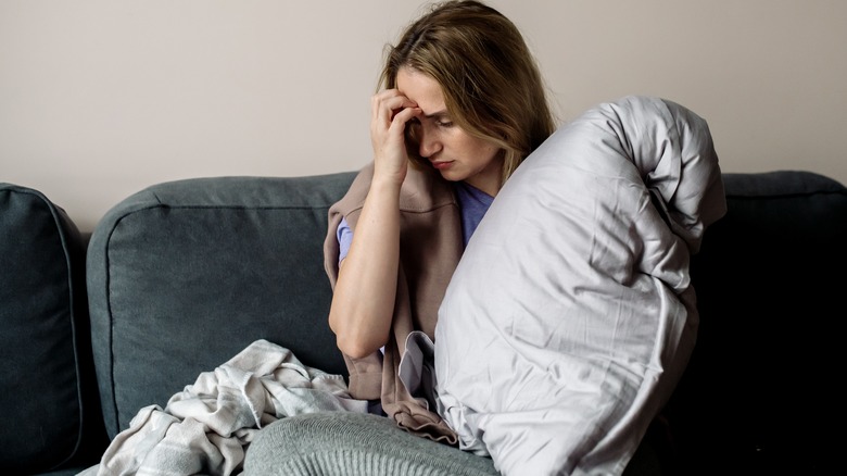 Woman sitting on couch