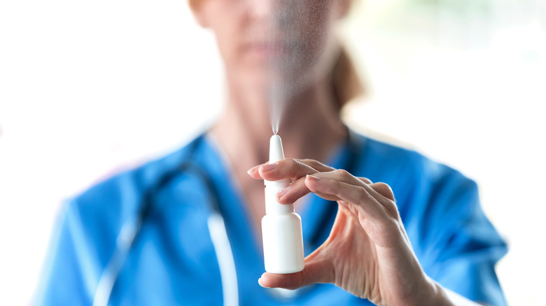 doctor spraying nasal spray