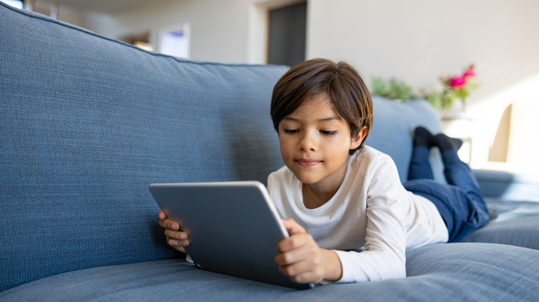 Kid looking at a screen 