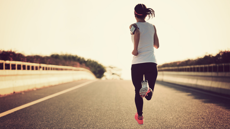 Woman running down road