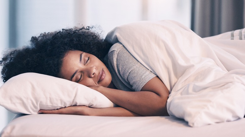 Woman sleeping in bed