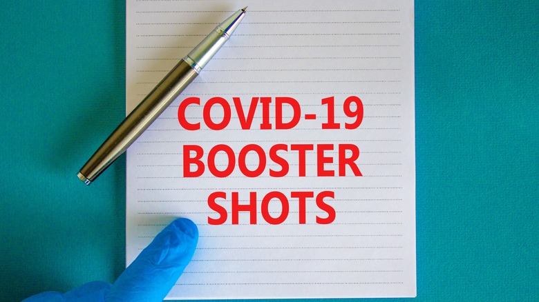 Note saying "Covid-19 booster shots"