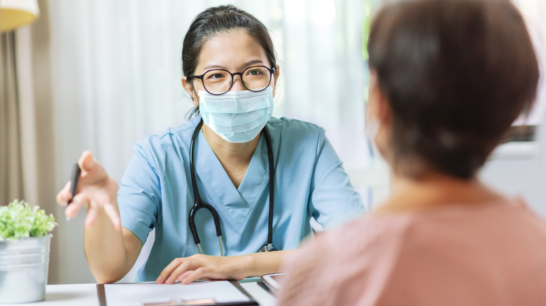 A doctor and patient talking