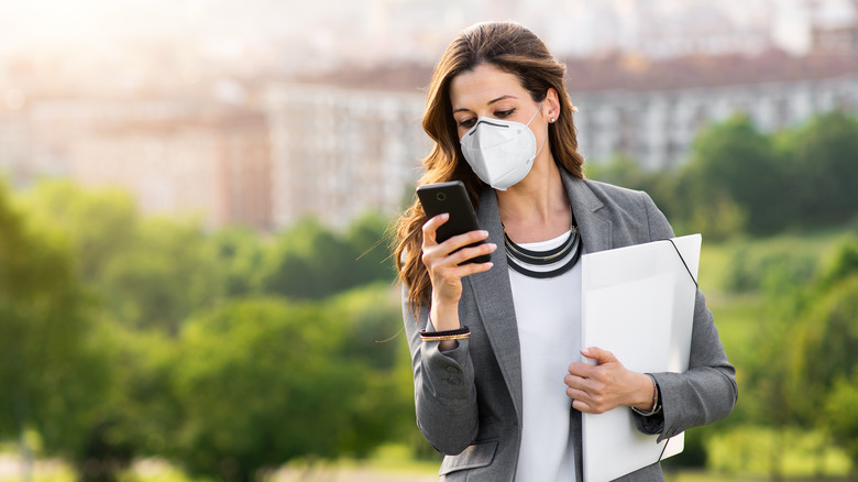 Woman wearing a mask outside 