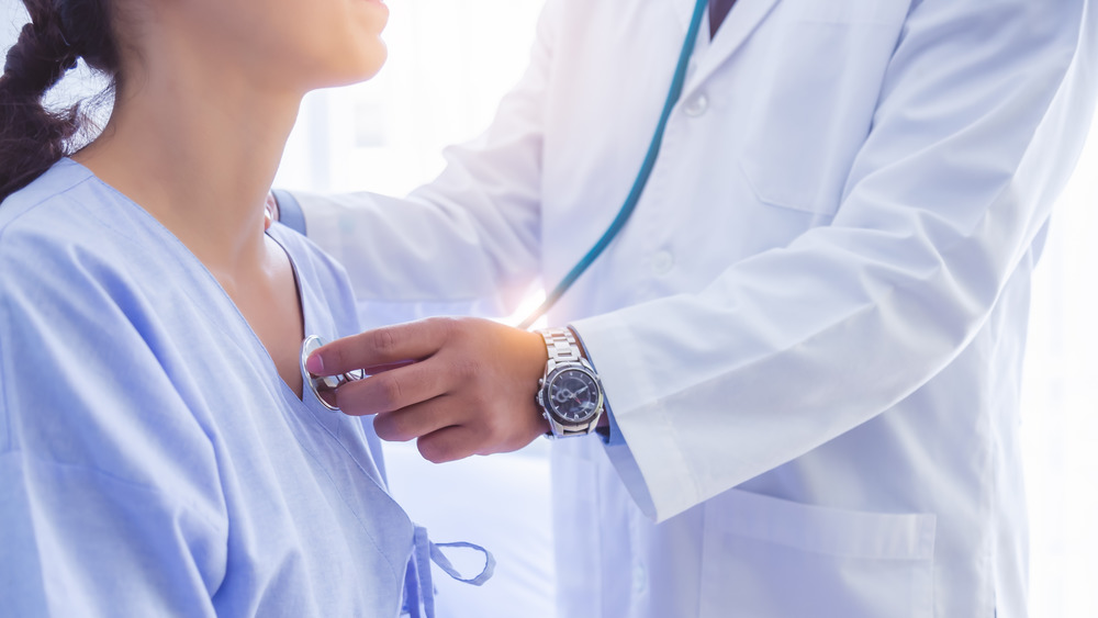 Doctor listening to a patient's heart