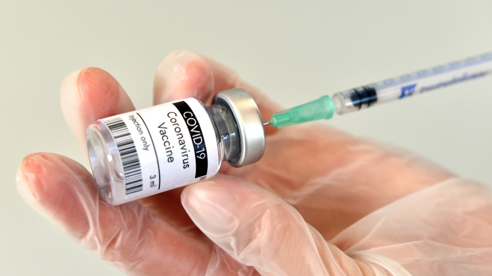 syringe and vial of covid-19 vaccine