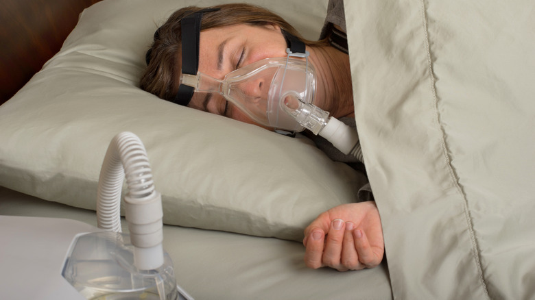 woman wearing cpap mask