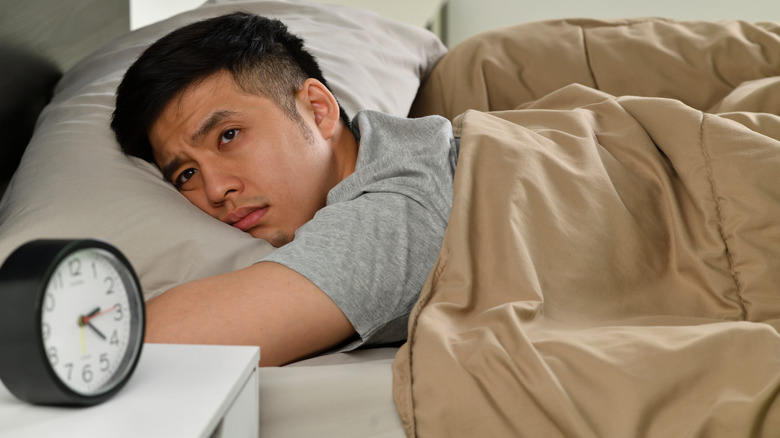 man awake in bed