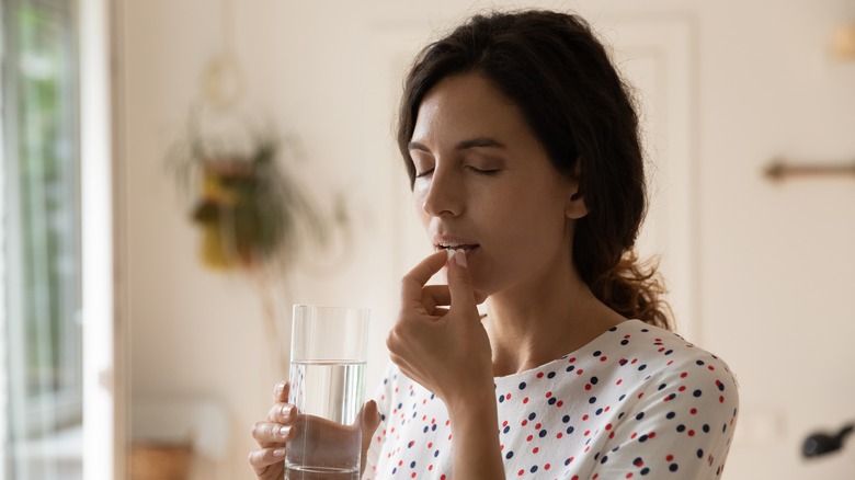 woman taking anntibiotics