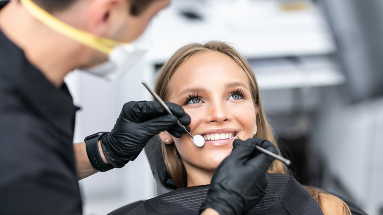 A woman is at the dentist
