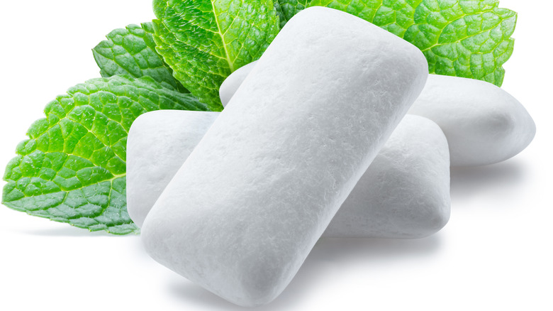 pieces of gum with mint in background