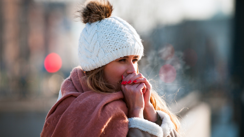 Woman standing outside in cold weather