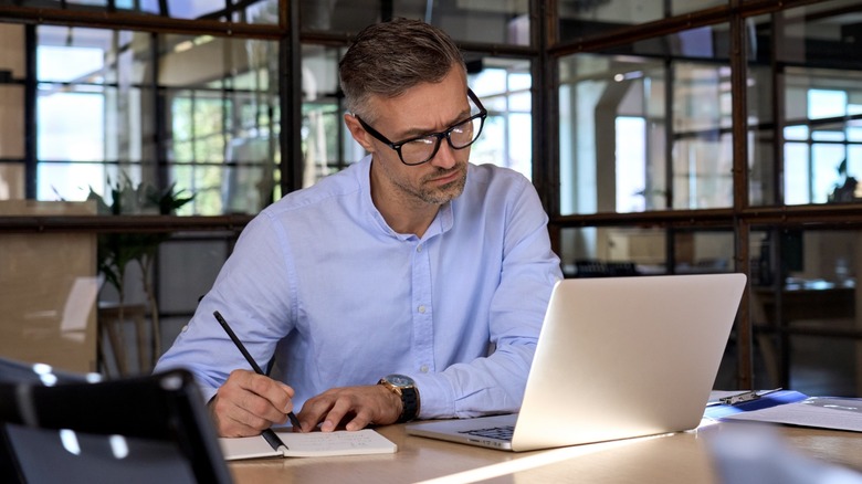 man sitting at desk