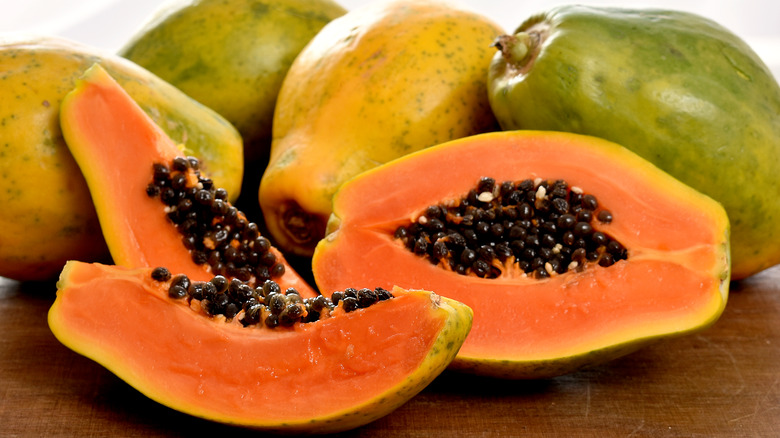 Several papayas on a table