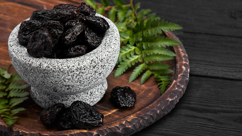Prunes in a stone bowl