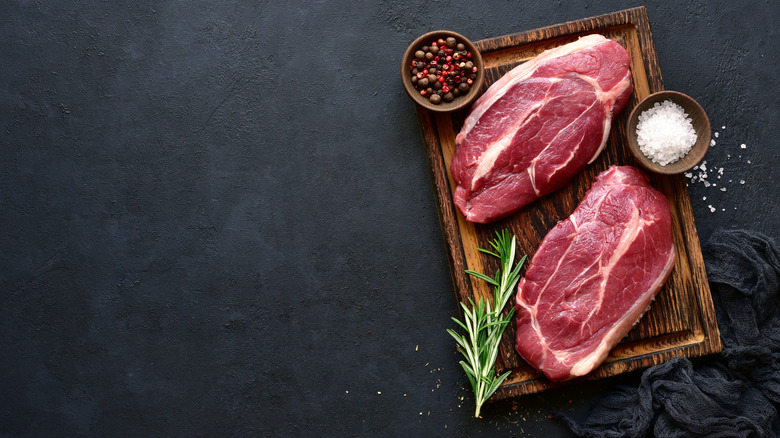 Raw meat on cutting board