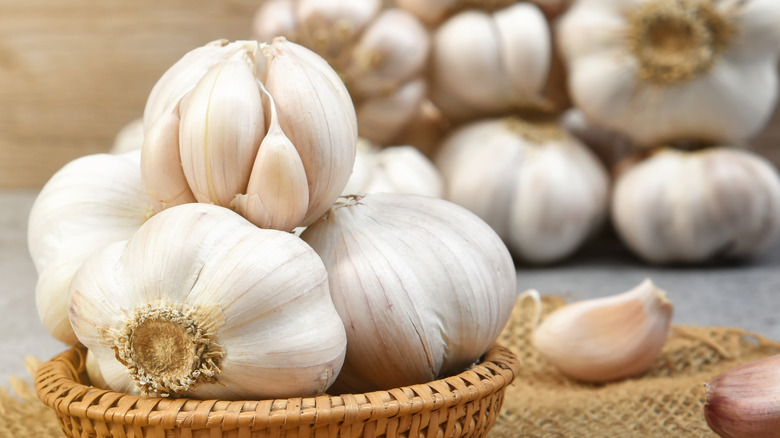 bowl of garlic on wooden table