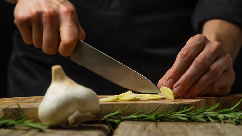 Man cutting garlic