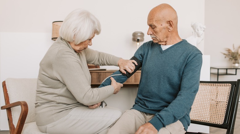 Man having blood pressure checked